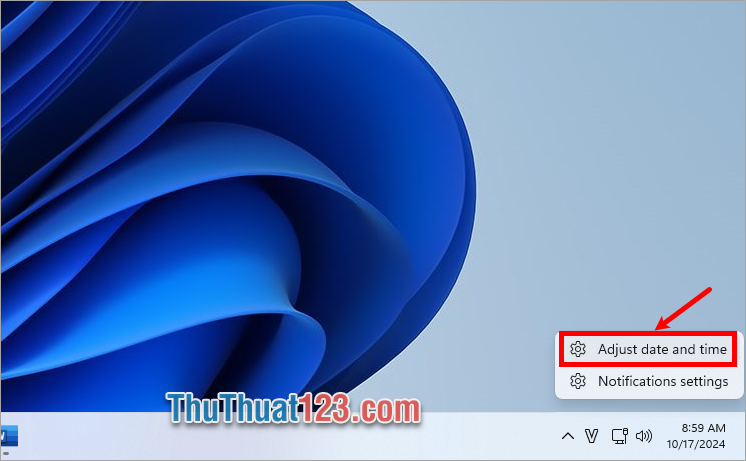 Nhấn chuột phải vào phần ngày giờ dưới thanh taskbar và chọn Adjust date and time